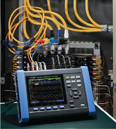 Technician reviewing power quality logs